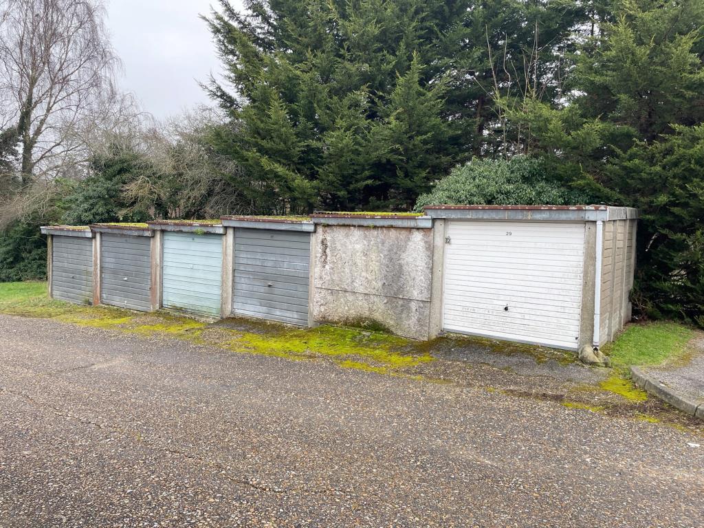 Lot: 50 - TWELVE GARAGES, PARKING AREA AND ADDITIONAL LAND - Garages